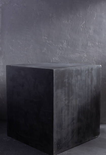 istock Grey or gray cube table near painted background texture. Abstract concept of modern minimalism design 1311501029