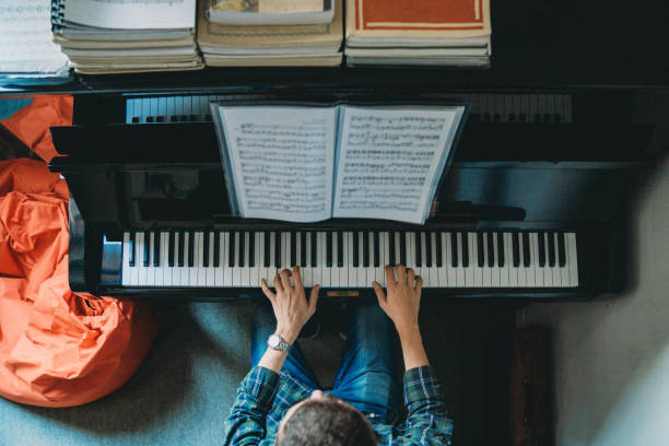 istock High angle view of a pianist playing piano 1311501601