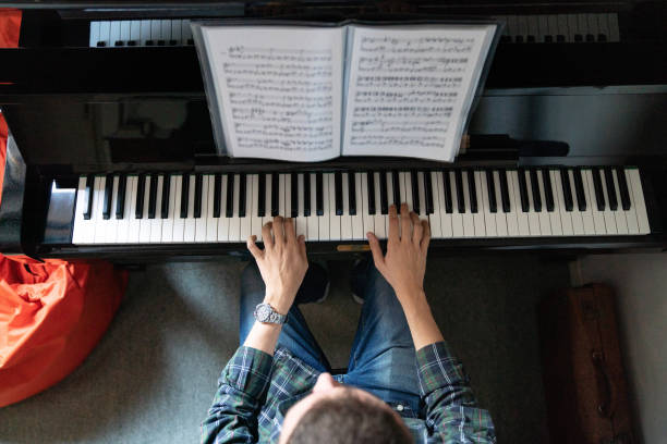istock High angle view of a pianist playing piano 1311501621