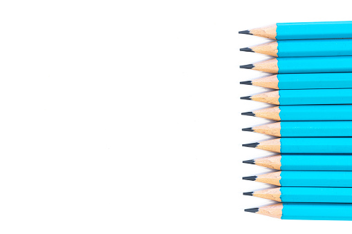 Close up blue pencils isolated on white background with copy space on left side.