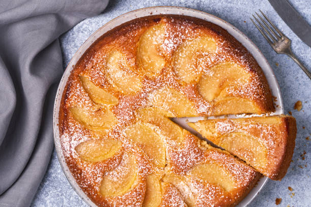 Composition with delicious apple tart on light background. Flat lay.