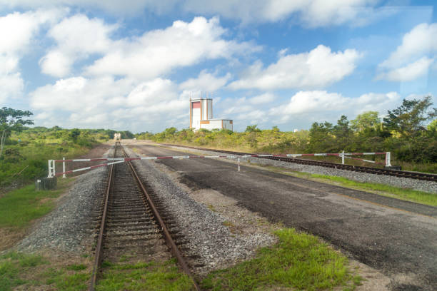 istock Gate, transport tracks and The final assembly building for Ariane 5 space rocket at Centre Spatial Guyanais (Guiana Space Centre) in Kourou, French Guiana 1311504860
