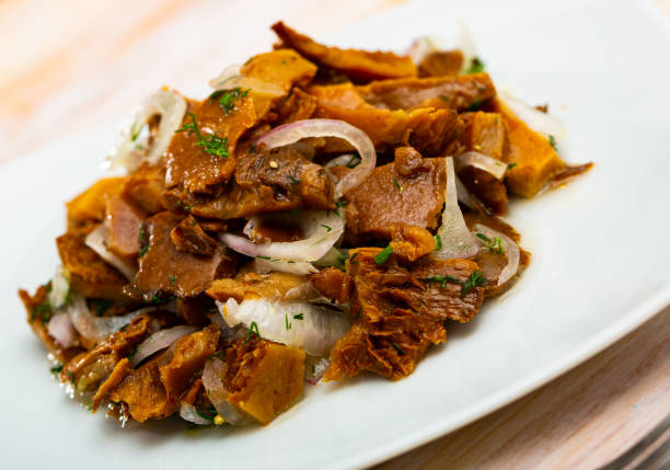 istock Pickled red pine mushrooms with onion 1311505589