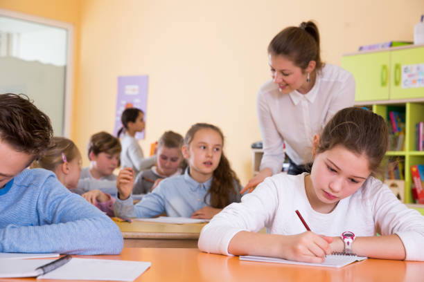istock Teacher and schoolkids during lesson 1311507489