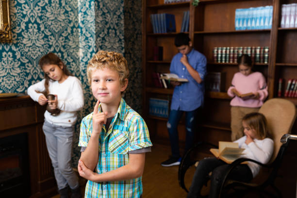 istock Preteen boy thinking about solving puzzle in escape room 1311507535
