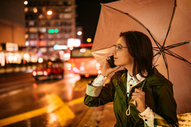 istock Woman talking on phone downtown 1311511591
