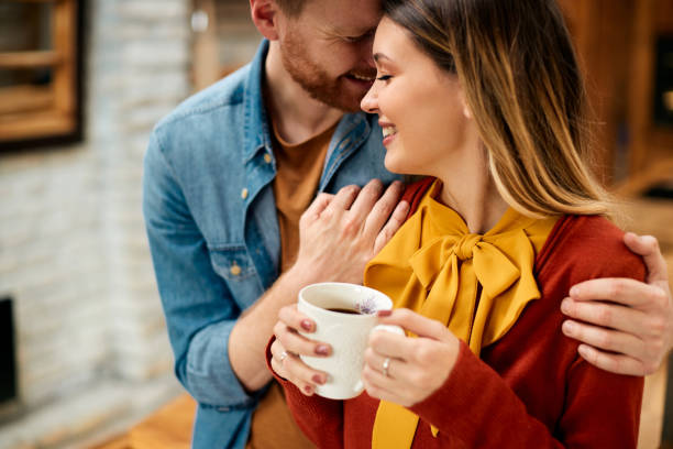 istock Young couple in love showing affection while spending time together at home. 1311512828