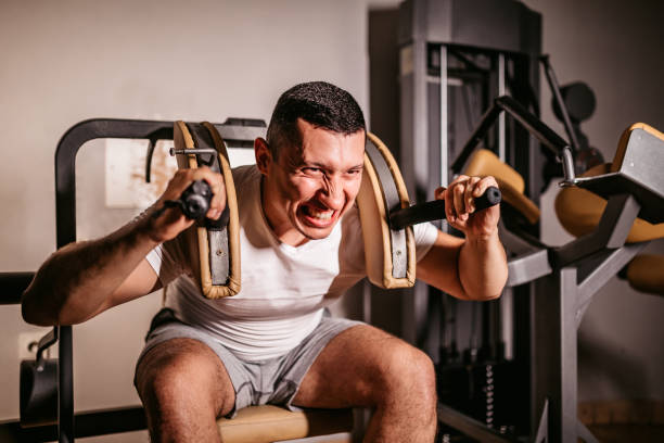 istock Man doing leg workout in a gym 1311512858