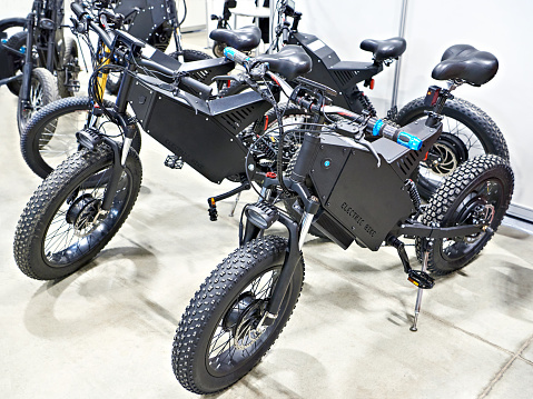 Electric motorcycle and bicycle hybrids on store exhibition