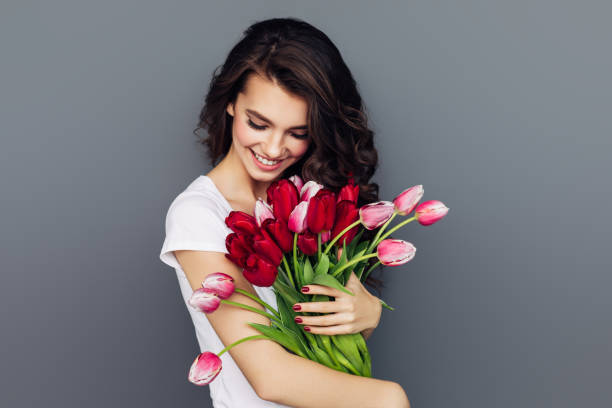 istock Beautiful woman with flowers 1311514177