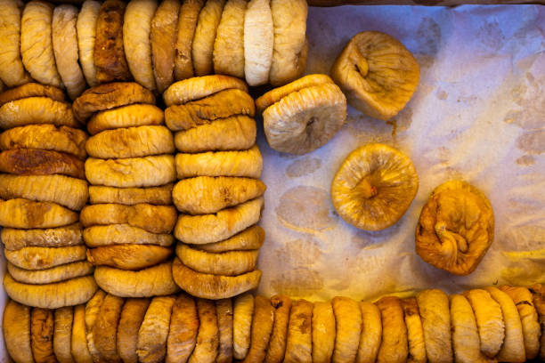 istock Dried figs in a box on parchment paper 1311516861