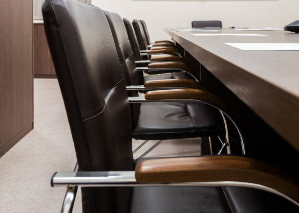 istock Modern leather chairs with wooden handles 1311517731