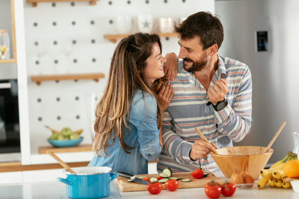istock Young couple making breakfast at home. stock photo 1311519982