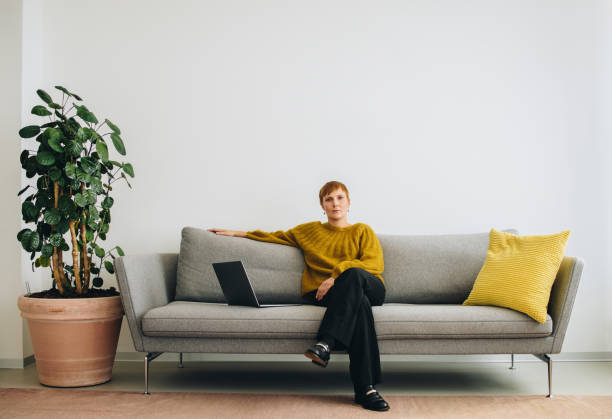 istock Female executive sitting on sofa in office lobby 1311521038