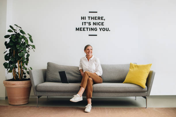 istock Happy female entrepreneur at office lobby 1311521468