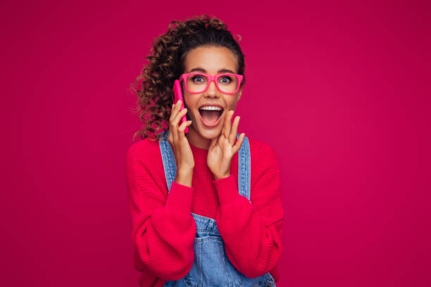 istock Beautiful woman with smart phone 1311523559