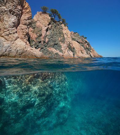 Under the sea surface after a wave has passed at Pedn Vounder Beach, South Cornwall on a sunny June day.