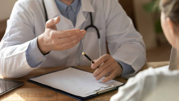 close up of male doctor talk consult patient - médico geral imagens e fotografias de stock