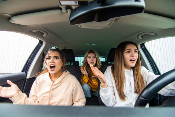 istock Three amazed shocked girlfriends travel in the car 1311526356