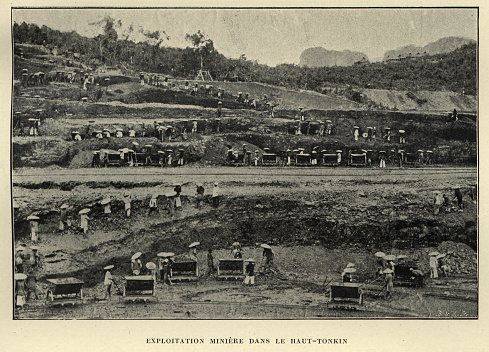 Vintage photograph of Open cast mining in Upper Tonkin, Vietnam, 19th Century. Open-pit mining, also known as open-cast or open cut mining, is a surface mining technique of extracting rock or minerals from the earth by their removal from an open-air pit,