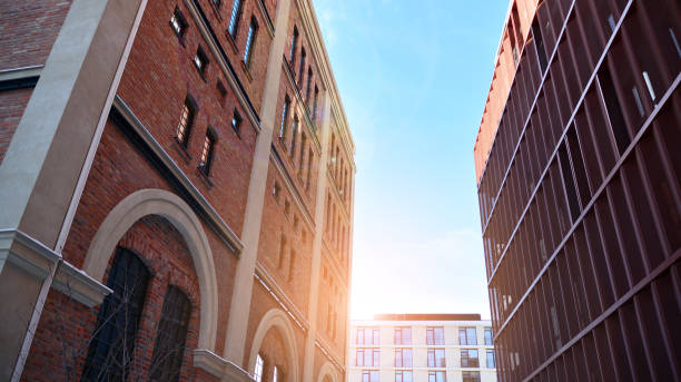 istock Revitalized red brick building and modern office building. 1311528692