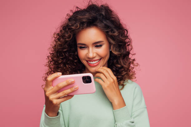 istock Beautiful woman with smart phone 1311529485