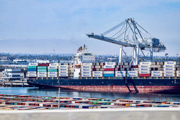 Cargo ship with containers in the Port of Los Angeles large cargo ship filled with containers in the Port Of Los Angeles in Long Beach, California USA san pedro los angeles photos stock pictures, royalty-free photos & images