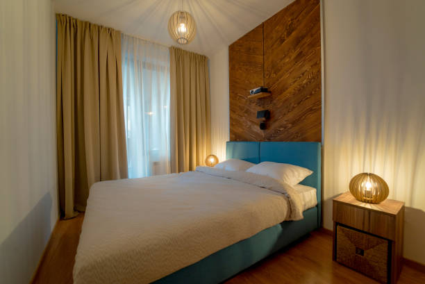 istock Cosy and tidy modern hotel bedroom 1311536627