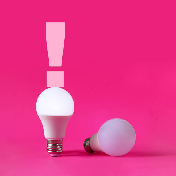 istock Light bulbs on magenta background. Discovery, invention, new idea concept. 1311539584