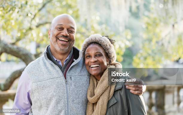 Mature Africanamerican Couple At The Park Stock Photo - Download Image Now - Senior Couple, African-American Ethnicity, Happiness