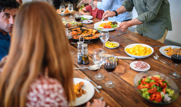 istock Family Members Conversing at Dining Table 1311546251