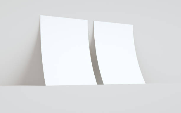istock A4 Flyer / Letterhead Mock-Up - Two Flyers Against Wall Background 1311546666