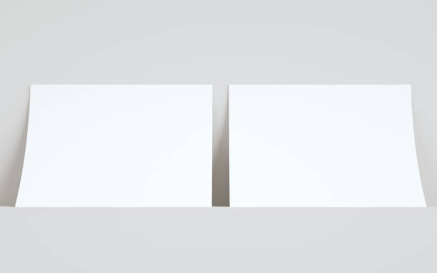 istock A4 Flyer / Letterhead Mock-Up - Two Flyers Against Wall Background 1311546667