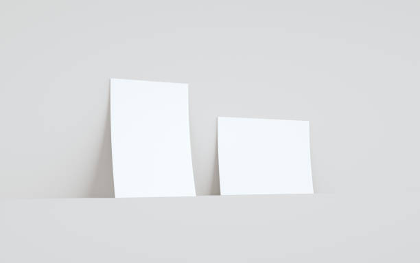 istock A5 Flyer / Brochure Mock-Up - Two Flyers Against Wall Background 1311546669