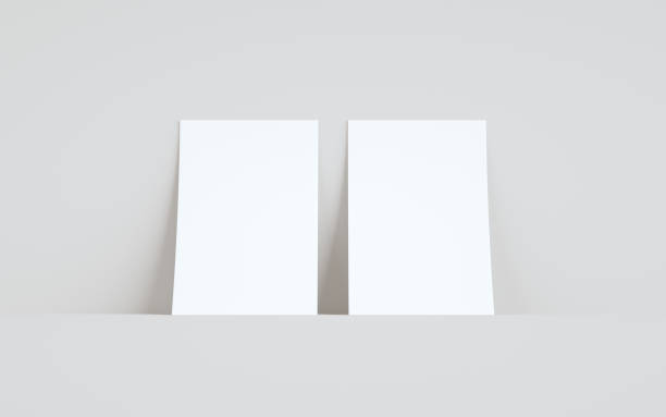 istock A5 Flyer / Brochure Mock-Up - Two Flyers Against Wall Background 1311546670