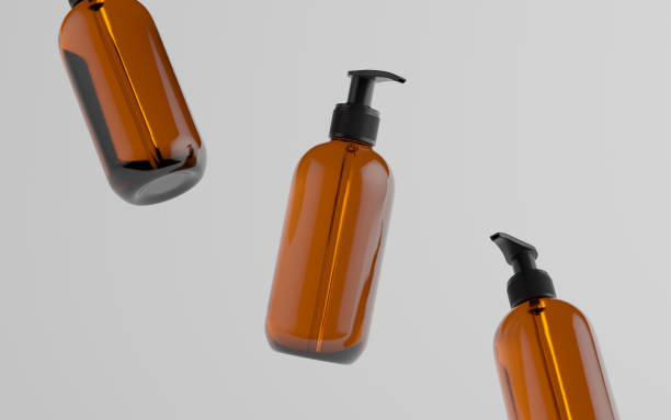 istock Amber Glass Pump Bottle Mock-Up - Liquid Soap, Shampoo Dispenser - Three Floating Bottles 1311546744