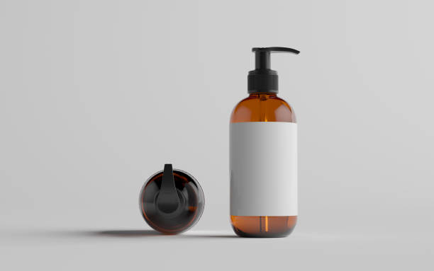 istock Amber Glass Pump Bottle Mock-Up - Liquid Soap, Shampoo Dispenser - Two Bottles. Blank Label 1311546761