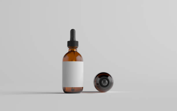 istock Amber Glass Dropper Bottle Mockup - Two Bottles. Blank Label 1311546769