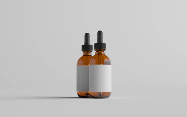 istock Amber Glass Dropper Bottle Mockup - Two Bottles. Blank Label 1311546777