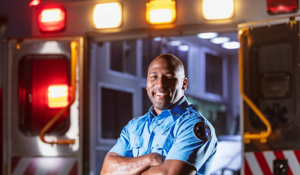istock Paramedic in front of ambulance 1311547584
