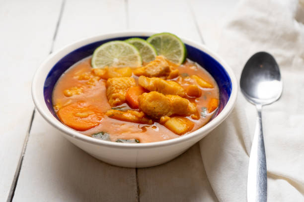 istock Fish soup with vegetables on white background. Mexican food 1311558737