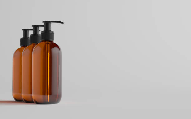 istock Amber Glass Pump Bottle Mock-Up - Liquid Soap, Shampoo Dispenser - Three Bottles 1311562180