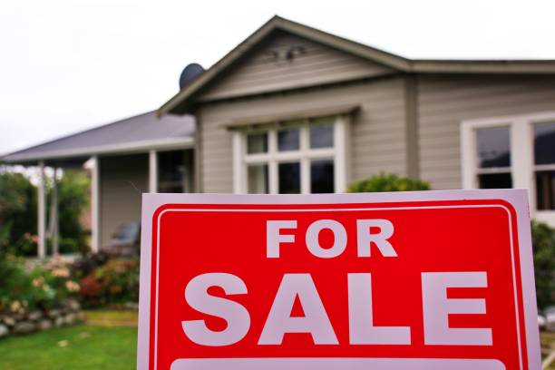 istock For Sale Sign Outside House 1311562234