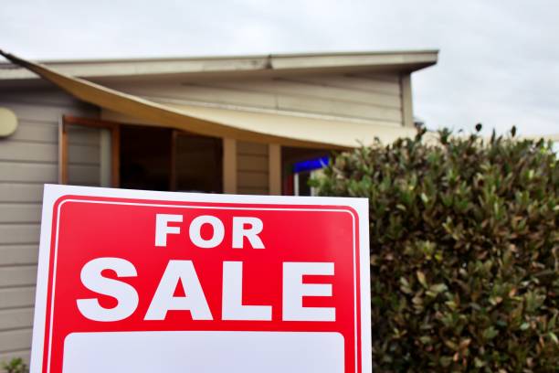 istock For Sale Sign Outside House 1311562243