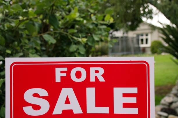 istock For Sale Sign Outside House 1311562928