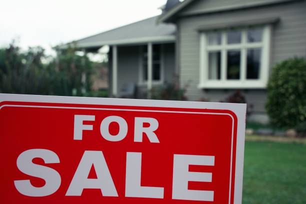 istock For Sale Sign Outside House 1311562933