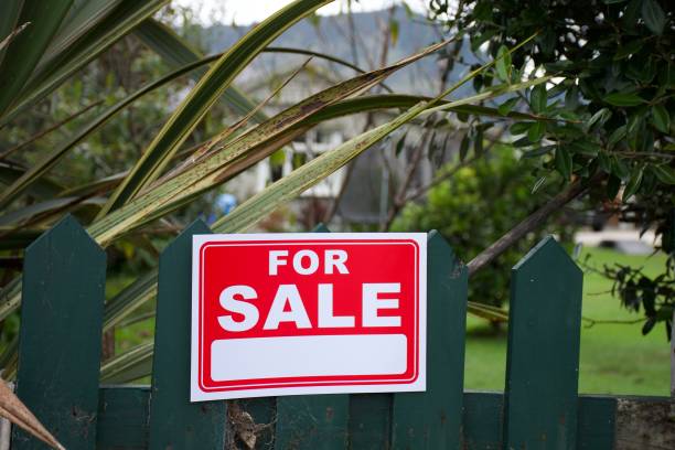 istock For Sale Sign Outside House 1311562993