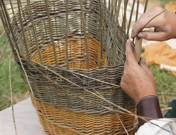 close-up to basket weaving at medieval market