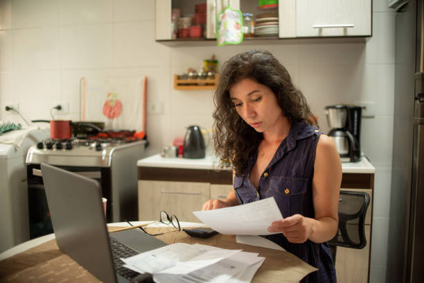 istock Woman doing financial accounts at home. Difficult financial situation. 1311567470