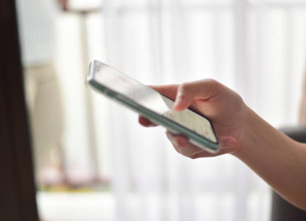 istock Hand women used smartphone on blur background. 1311568572
